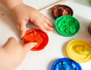 Child Playing with Finger Paint
